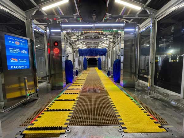 An outside photo of the ModBrite Car Wash at night