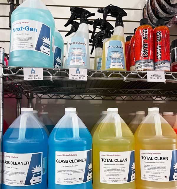 Auto detailing chemicals and supplies sitting on shelves