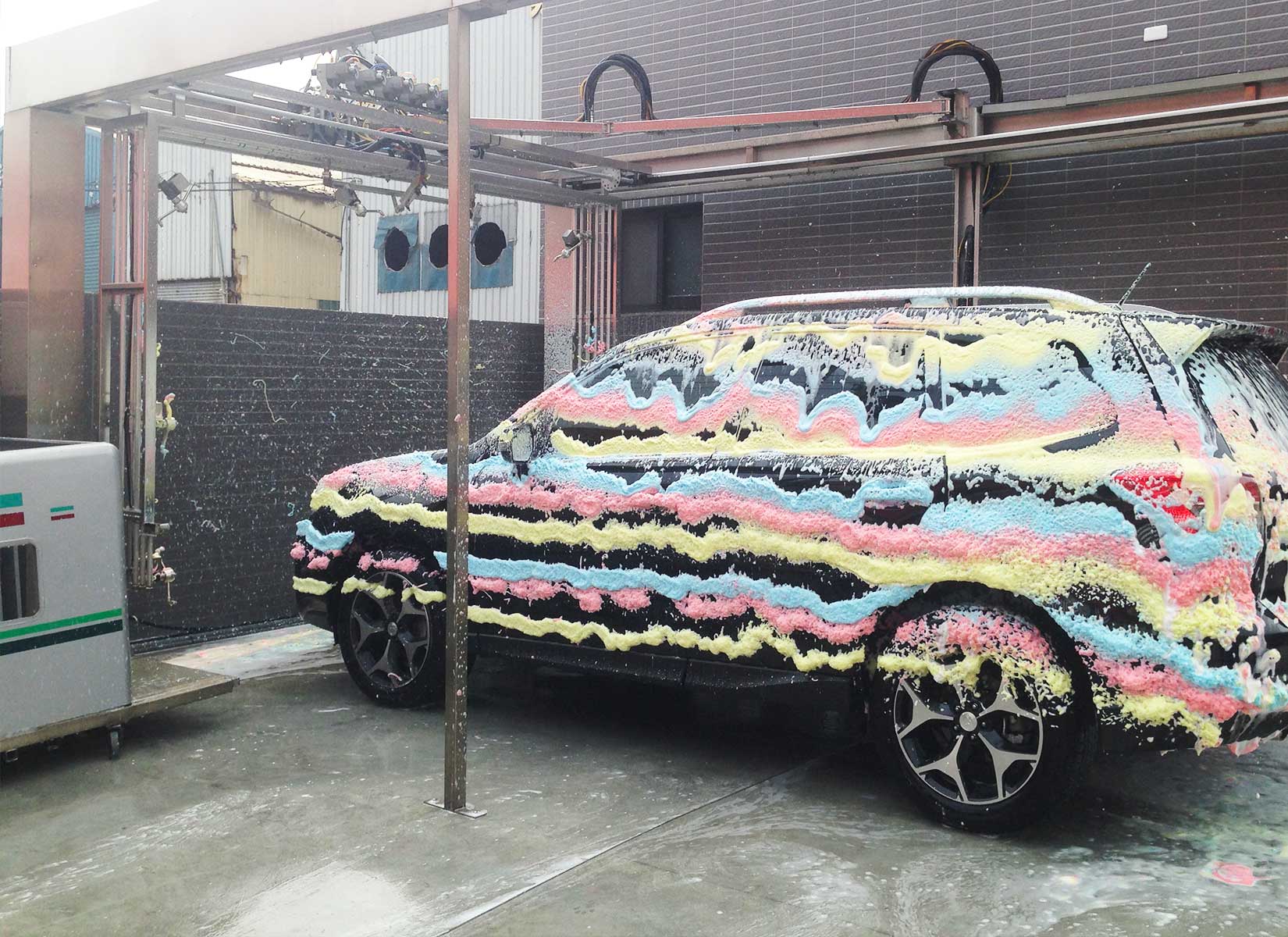Car with multicolored foam spray on it
