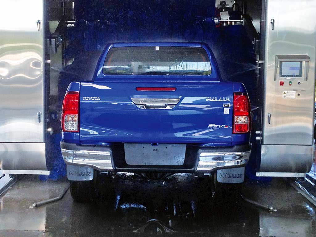 Blue truck going through the TouchBrite car wash