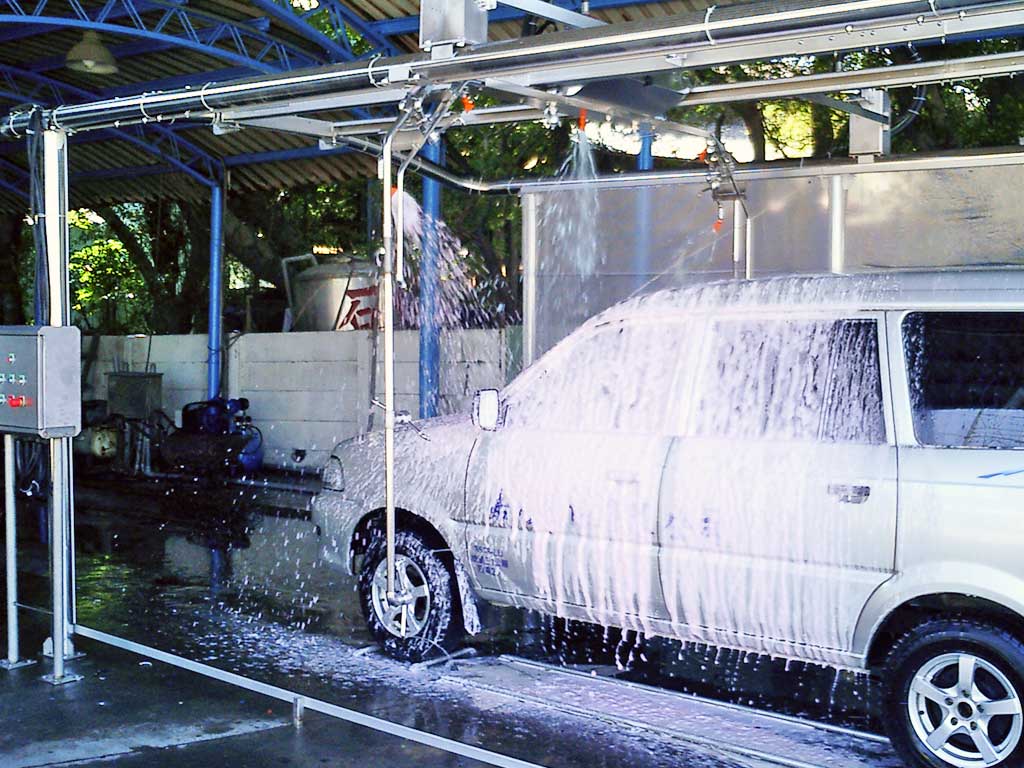 Car going through the foam step in a self-service car wash